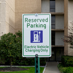 Obraz premium Reserved Parking Electric Vehicle Charging Only sign with pictograph