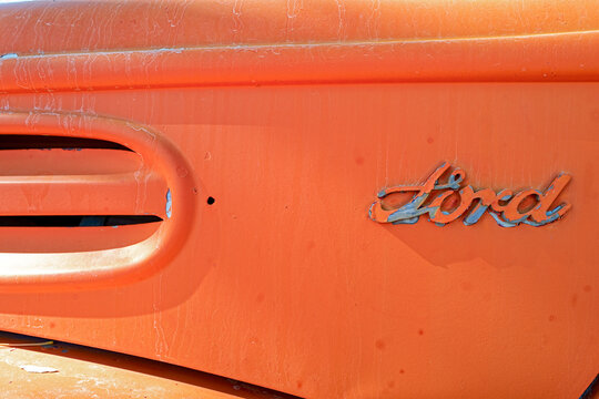 The Ford emblem on an abandoned oil truck in the desert in Nevada, USA - November 4, 2022