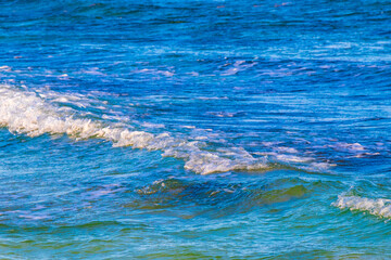 Waves at tropical beach caribbean sea clear turquoise water Mexico.