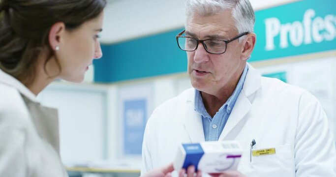 Man, pharmacist and help customer with medicine, pills or medication in pharmacy. Pharmaceutical, senior and woman with doctor shopping for drugs, medical product or advice in healthcare retail store