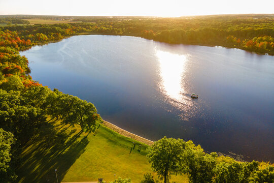 Aerial view of a boat at sunset on a Michigan lake