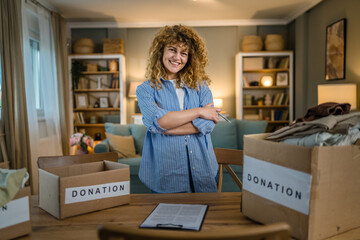 One young adult woman prepare wardrobe clothes for charity donation