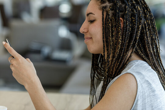Informal work and study, box braids-haired woman