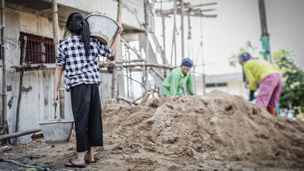 Child working at construction site. World Day Against Children Labour concept.