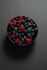 Blueberry Raspberry mixed on dark background 