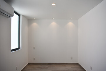 Empty spaces with lighting and white walls