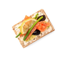 Fresh crunchy crispbread with cream cheese, salmon, olives, lemon and green onion on white background, top view