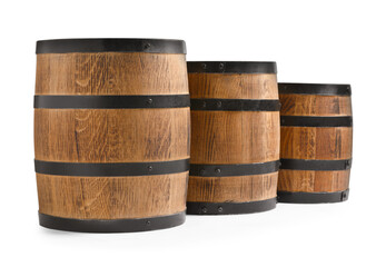 Fototapeta premium Three traditional wooden barrels on white background