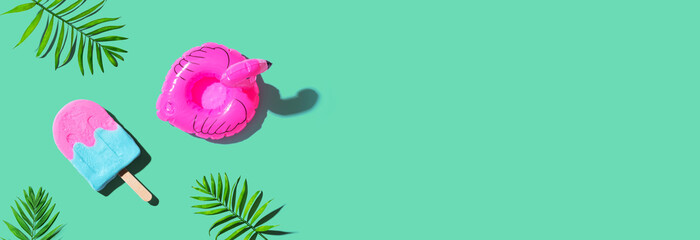 Pink and blue popsicle with a flaming float - flat lay