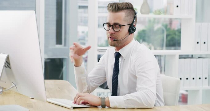 Call center man, talking and advice by computer on headset, microphone and smile for consulting job. Crm, telemarketing consultant or agent with customer service, tech support and help desk in office