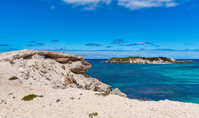 Hamelin Bay, a vast expanse of bright white sand, turquoise waters filled with marine life, and...
