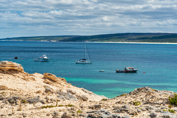 Hamelin Bay, a vast expanse of bright white sand, turquoise waters filled with marine life, and...