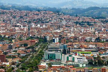 Fototapeta na wymiar Panoramic top view of the city of Cuenca, located in the valley, from the observation deck of Turi, Ecuador