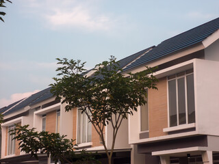 Tropical residential area with greenery, condos and houses.