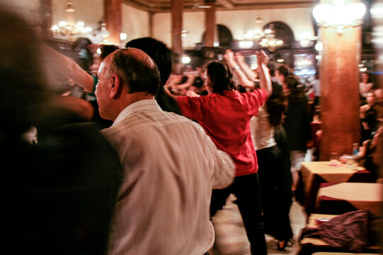 Group of people celebrating life by dancing at social party.