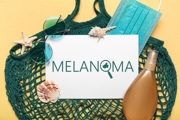 Banner with beach accessories and word MELANOMA
