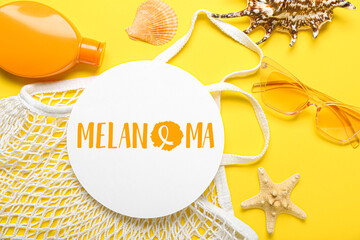 Banner with beach accessories and word MELANOMA