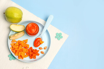 Plate with fresh apple, vegetables and jar of baby food on color background