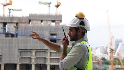 Slow-motion Construction engineer hard working on site of new building construction