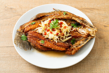 Fried Sea Bass Fish with Fish Sauce and Spicy Salad