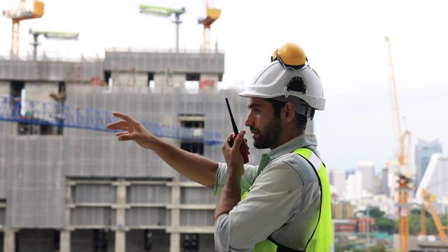 Slow-motion Construction engineer hard working on site of new building construction