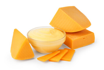 Bowl with tasty cheddar sauce and chunks of cheese on white background