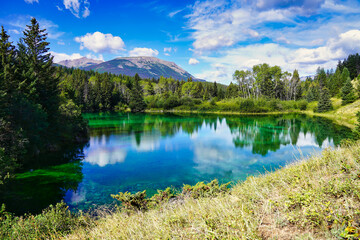 Naklejka na ściany i meble Aquamarine blue-green shades of the magnificient and beautiful lakes in the Valley of Five Lakes Region near Jasper in the Canada Rockies