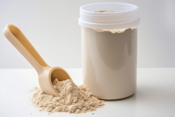 Protein powder with plastic scoop on white background