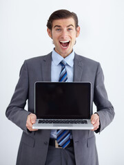 Laptop, mockup and happy with portrait of man in studio for website, email and administration. Business, excited and technology with employee in white background for corporate, internet or networking