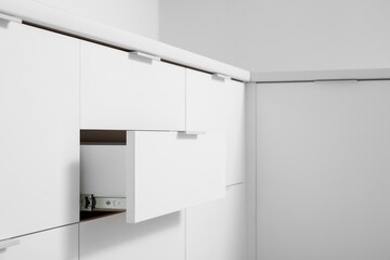 White counters with drawers in light kitchen