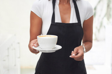 Coffee cup, giving and woman hands for restaurant service, hospitality and customer experience. Latte, drink or espresso with waitress or person in cafe closeup for industry, business or shop barista