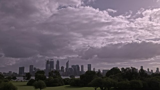 Clouds sweep over Perth City with Swan River and South Perth park in foreground - Timelapse
