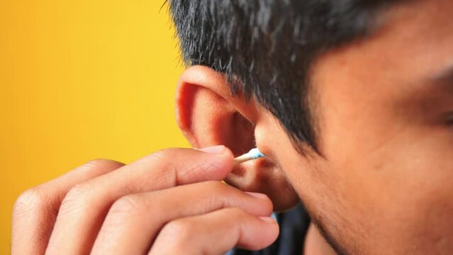 men using a ear cotton bar 