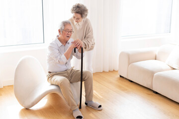 Senior woman taking care of her husband