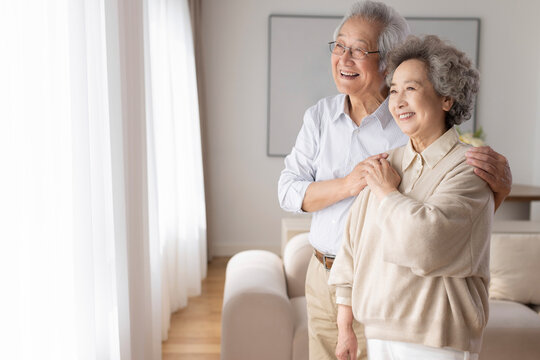 Cheerful senior couple relaxing at home