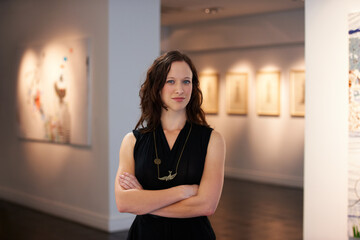 Expert, arms crossed and portrait of a woman at an art gallery for an exhibition. Creative, culture and a museum manager with management of paintings, collection and curator of pictures at a studio - obrazy, fototapety, plakaty