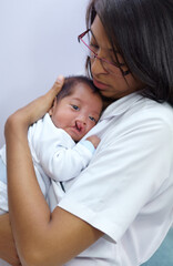 Medicine, cleft lip and a pediatrician with a baby in the hospital for healthcare, insurance or treatment. Medical, children and a doctor woman holding a newborn infant with a disability in a clinic