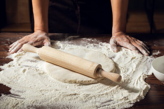 Midsection of chef making noodles