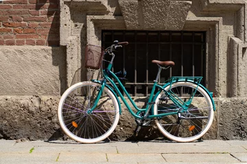 Foto op Plexiglas Lots of bikes parked on the street in Milan. © G_T_K_