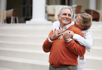 Hug, retirement and an old couple on hotel steps for travel, vacation or tourism in luxury...
