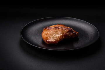 Delicious juicy pork or beef steak with salt, spices and herbs
