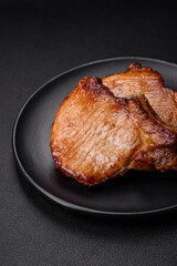 Delicious juicy pork or beef steak with salt, spices and herbs