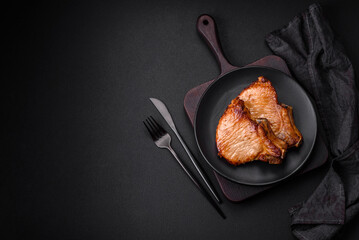 Delicious juicy pork or beef steak with salt, spices and herbs