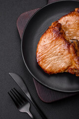 Delicious juicy pork or beef steak with salt, spices and herbs