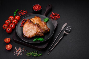 Delicious juicy pork or beef steak with salt, spices and herbs