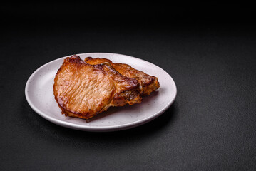 Delicious juicy pork or beef steak with salt, spices and herbs