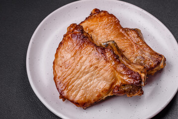 Delicious juicy pork or beef steak with salt, spices and herbs
