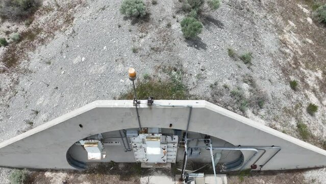 Aerial Tekoi solid fuel rocket motor storage bunker Utah climb pu. Military solid fuel rocket test facility. Abandoned weapon bunkers and missile buildings. Secret Cold War munitions. Nuclear missile.