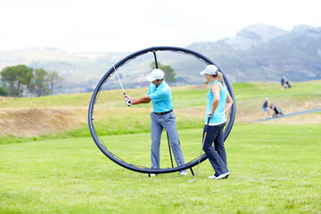 Ring, sports woman or golfer in golf course lesson for fitness, workout or exercise with a swing on field. Coaching, golfing game or athlete training with instructor for driving with a club stroke