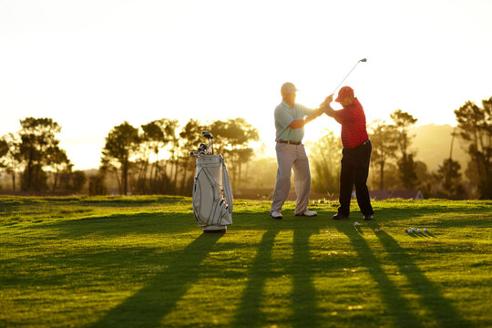 Trainer, golf course or man with help, teaching or fitness with training, lesson or skills. Male person, player or coach with golfer, advice or sports with professional, physical activity or exercise